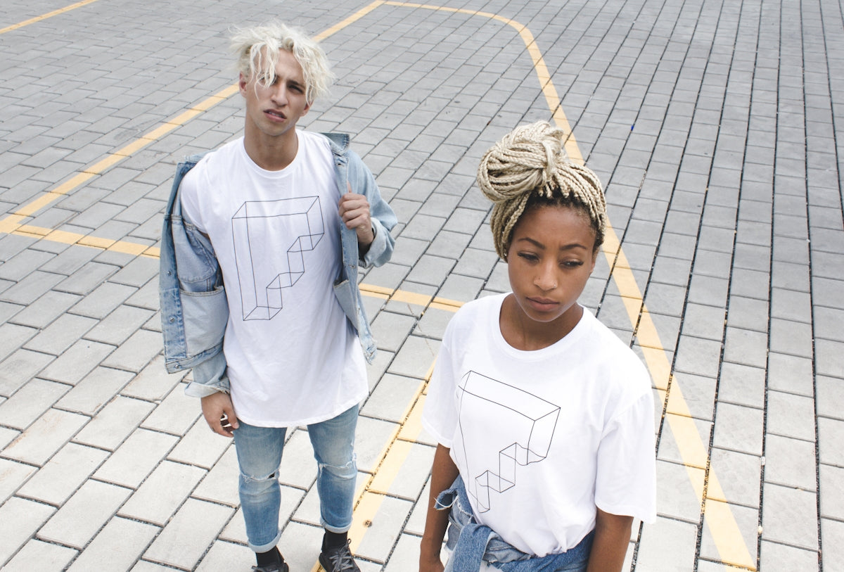 Two young people wearing white t-shirts with designs