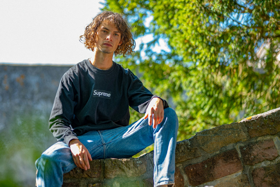 a person sitting on a rock